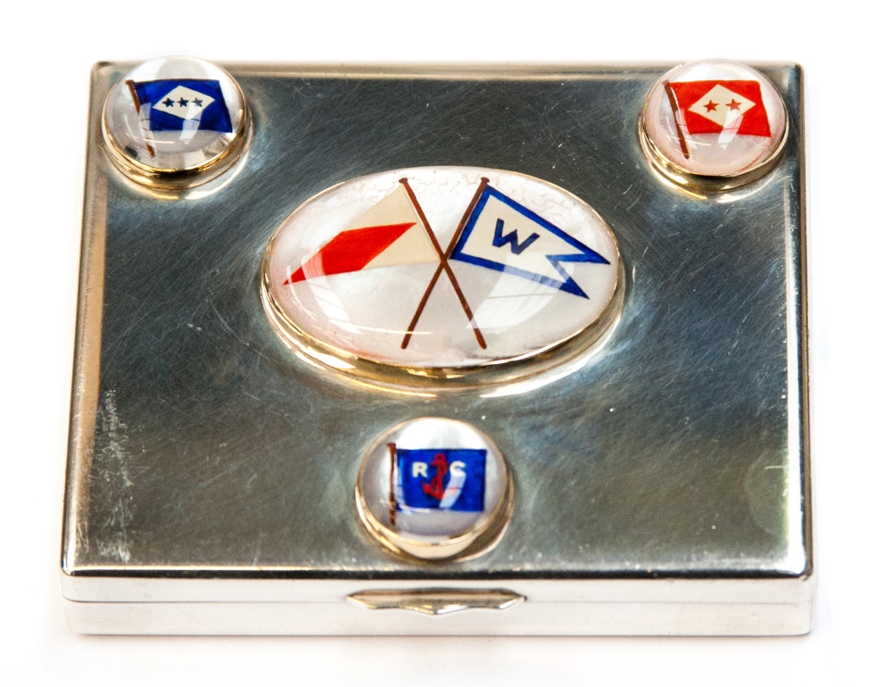 American Yachting Interest - A white metal compact, set with four mother of pearl panels,