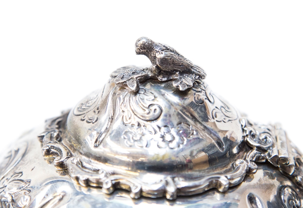 A Victorian silver bachelors tea set, of ogee form with heavy repousse type Rococo decoration and - Image 2 of 3