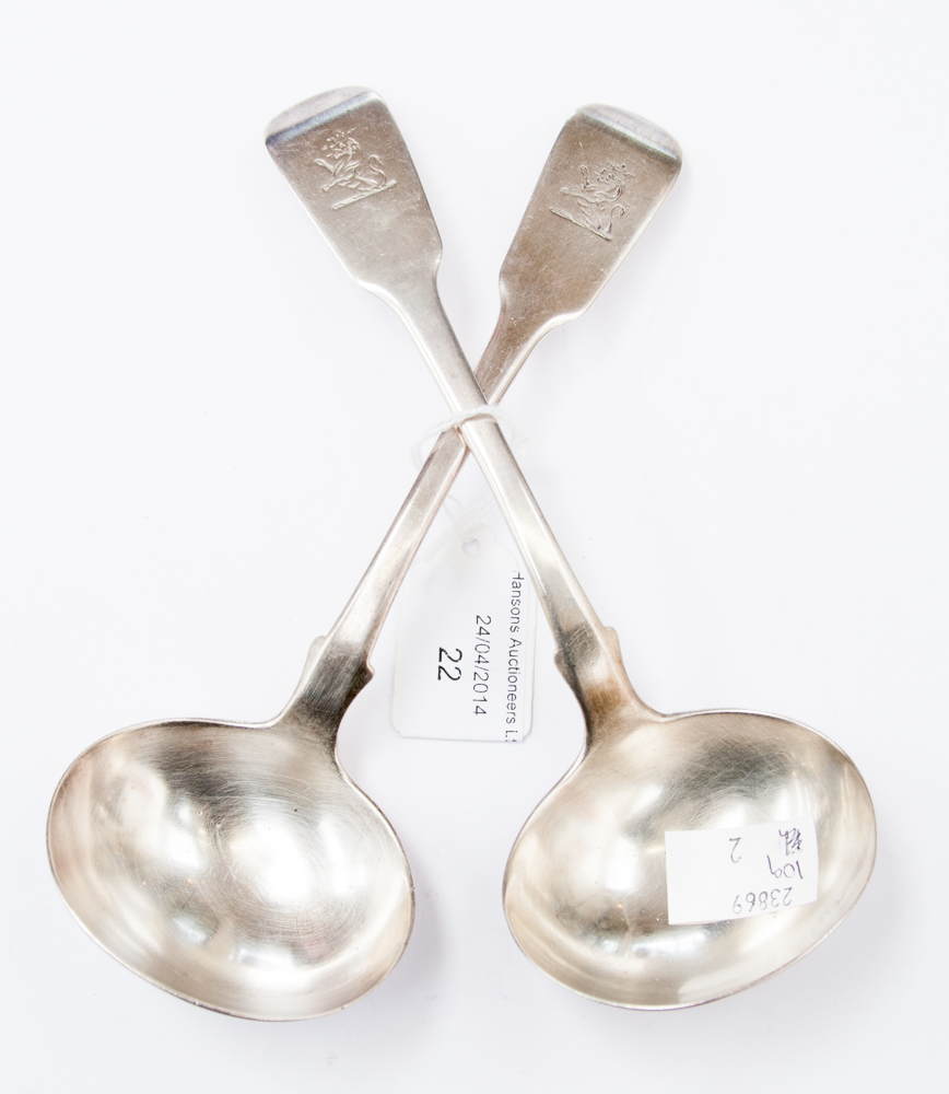 A pair of early Victorian silver sauce ladles, fiddle pattern, maker JB London, crested