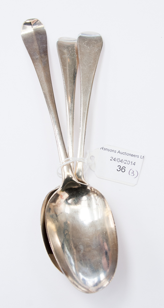 A pair of George II silver dessert spoons, London 1750; together with another Hanoverian spoon