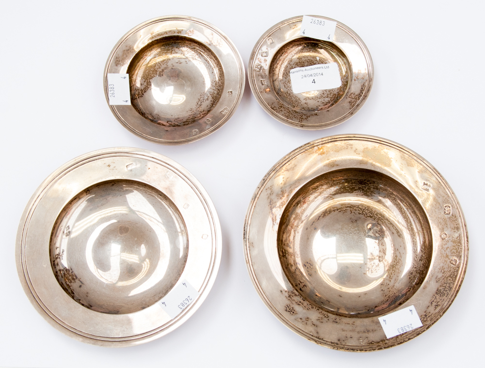 A set of four graduated silver dishes, hallmarked for London for the years 1975, 1989 and 1992,