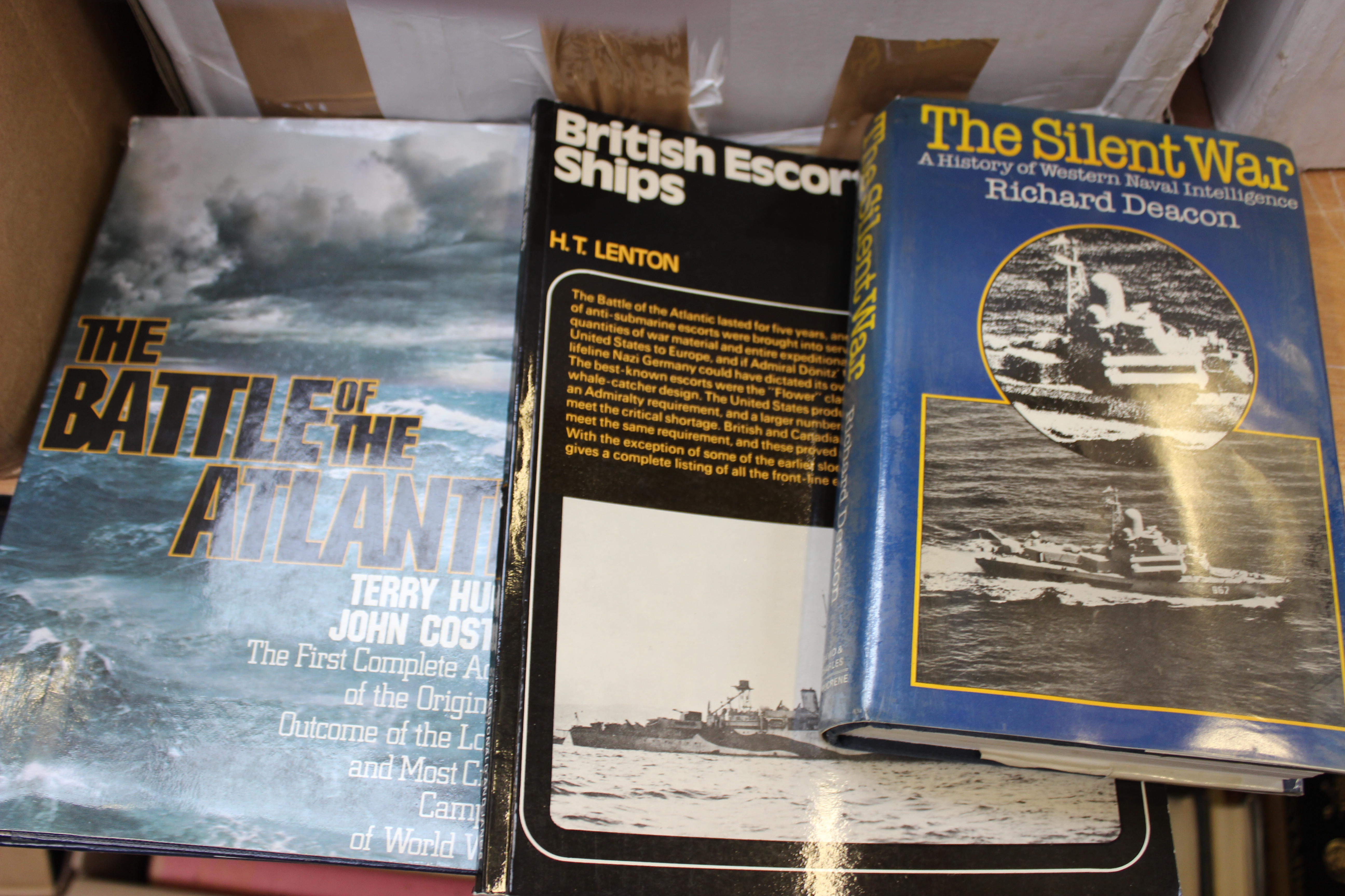 A box of books on Ships including Jane's 76/77