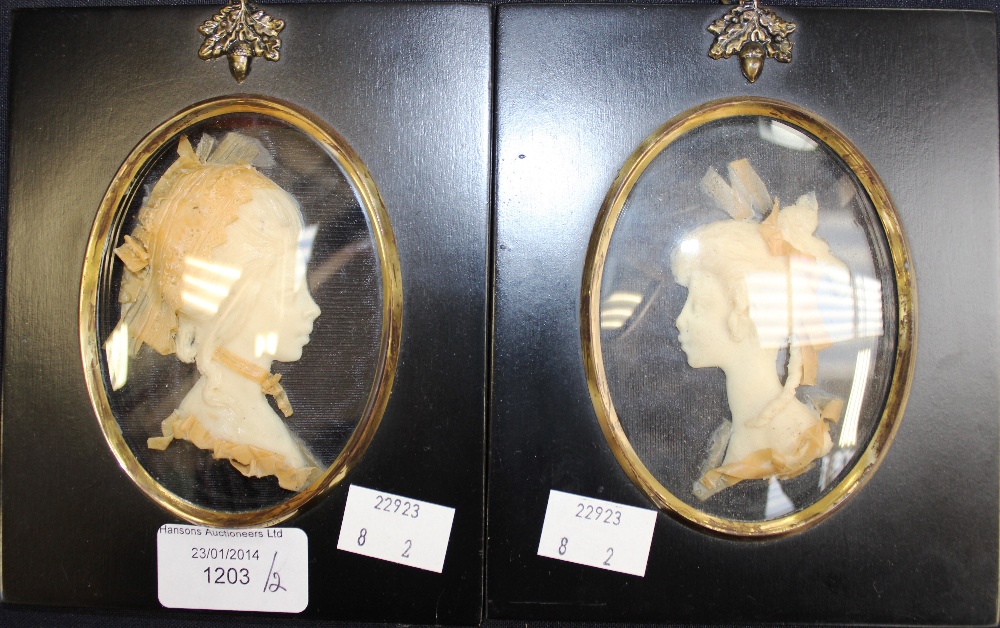 Leslie Ray, toe wax relief portraits of Ladies in 18th century costume, framed