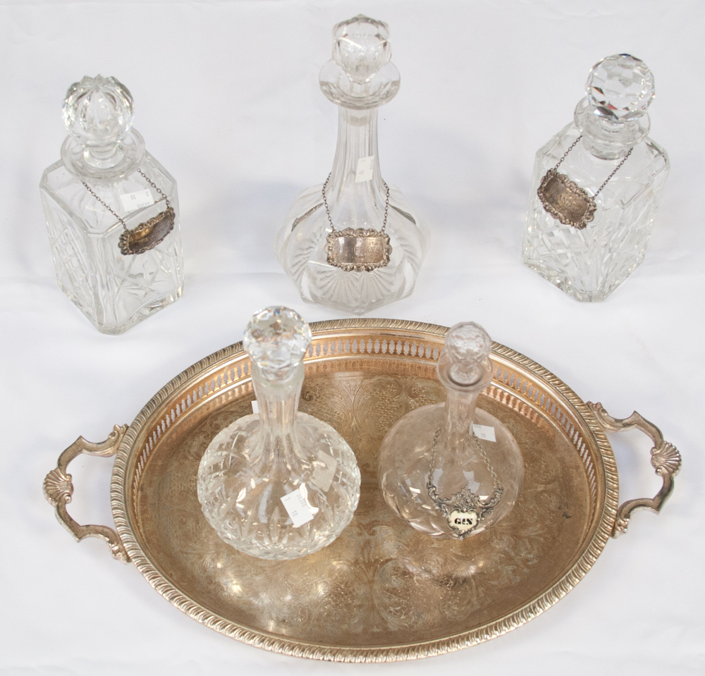 Three Birmingham silver spirit labels on a pair of spirit decanters and a sherry decanter;