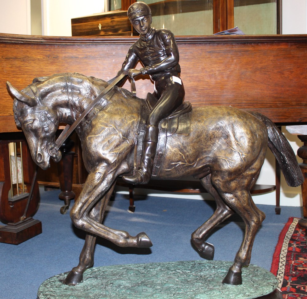 A large 20th Century bronze figure of Jockey and Horse in the manner of Pierri Jules Mene, measuring