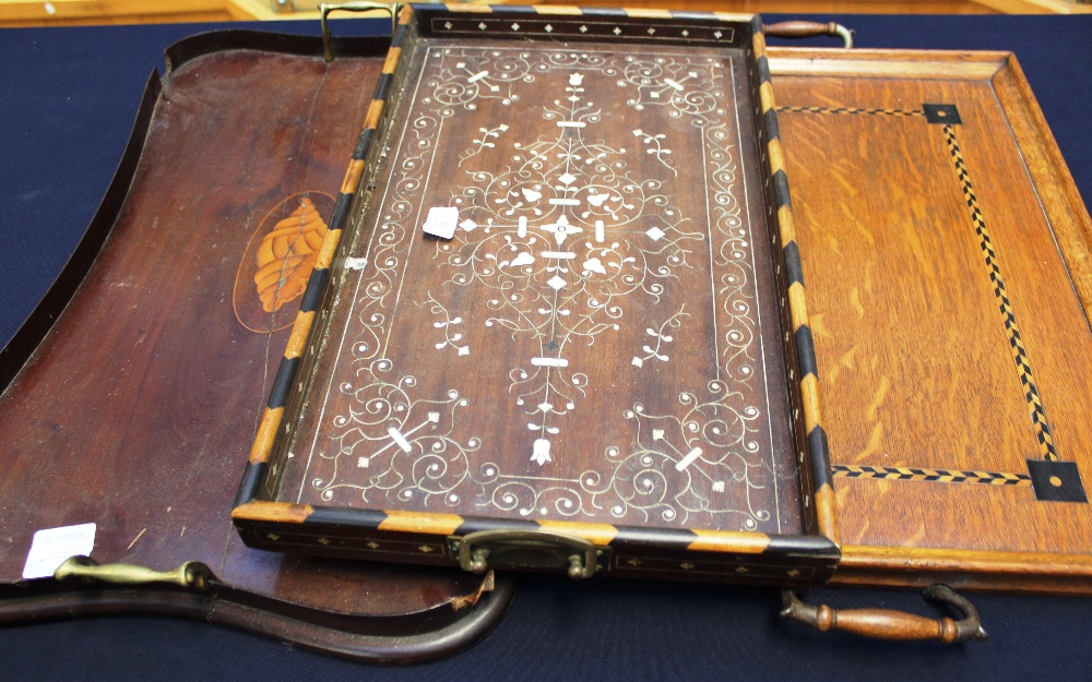 Three inlaid Edwardian twin handled trays - one mahogany with brass handles, one oak, inlaid with