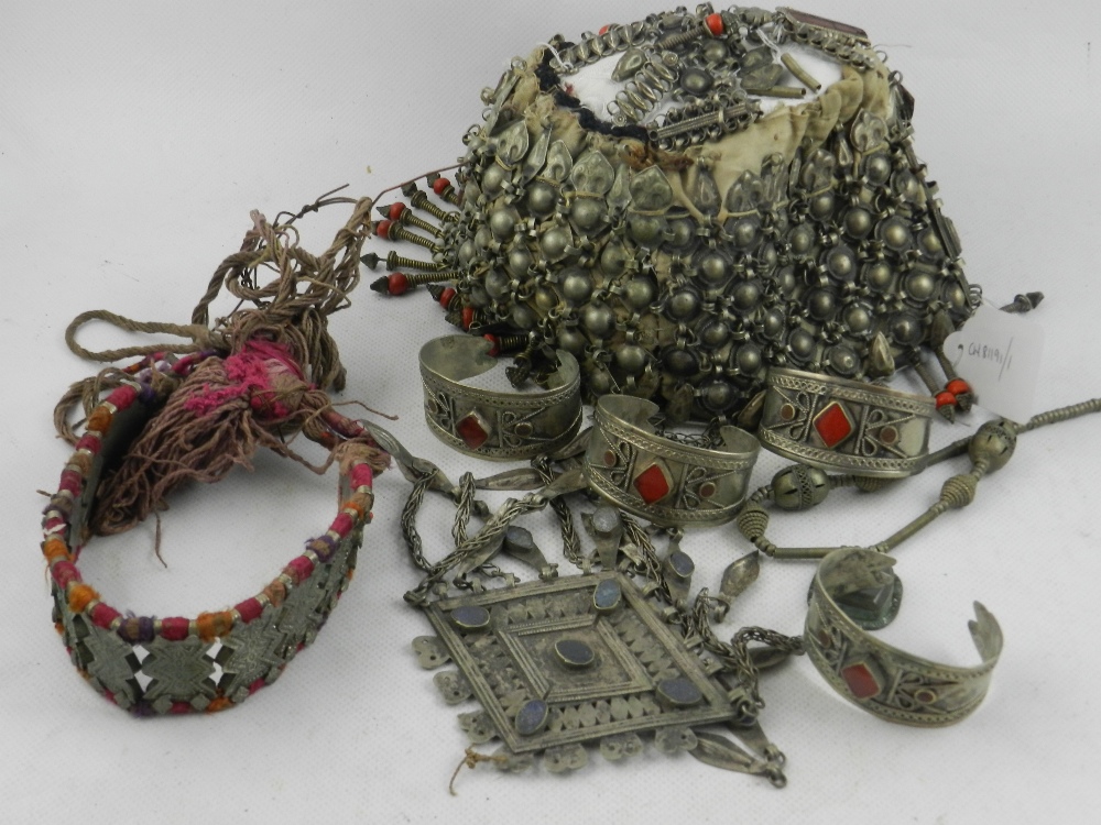 An unusual Turkish/Ottoman metal mounted hat with fringe drops, together with sundry nomad
