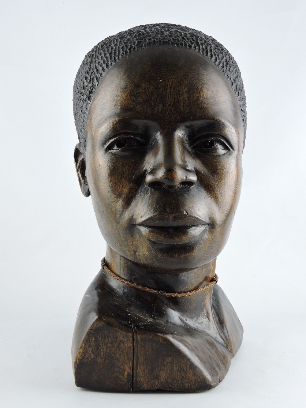 **WITHDRAWN** A 20th century hardwood carved head, in the form of an African, H. 46cm.