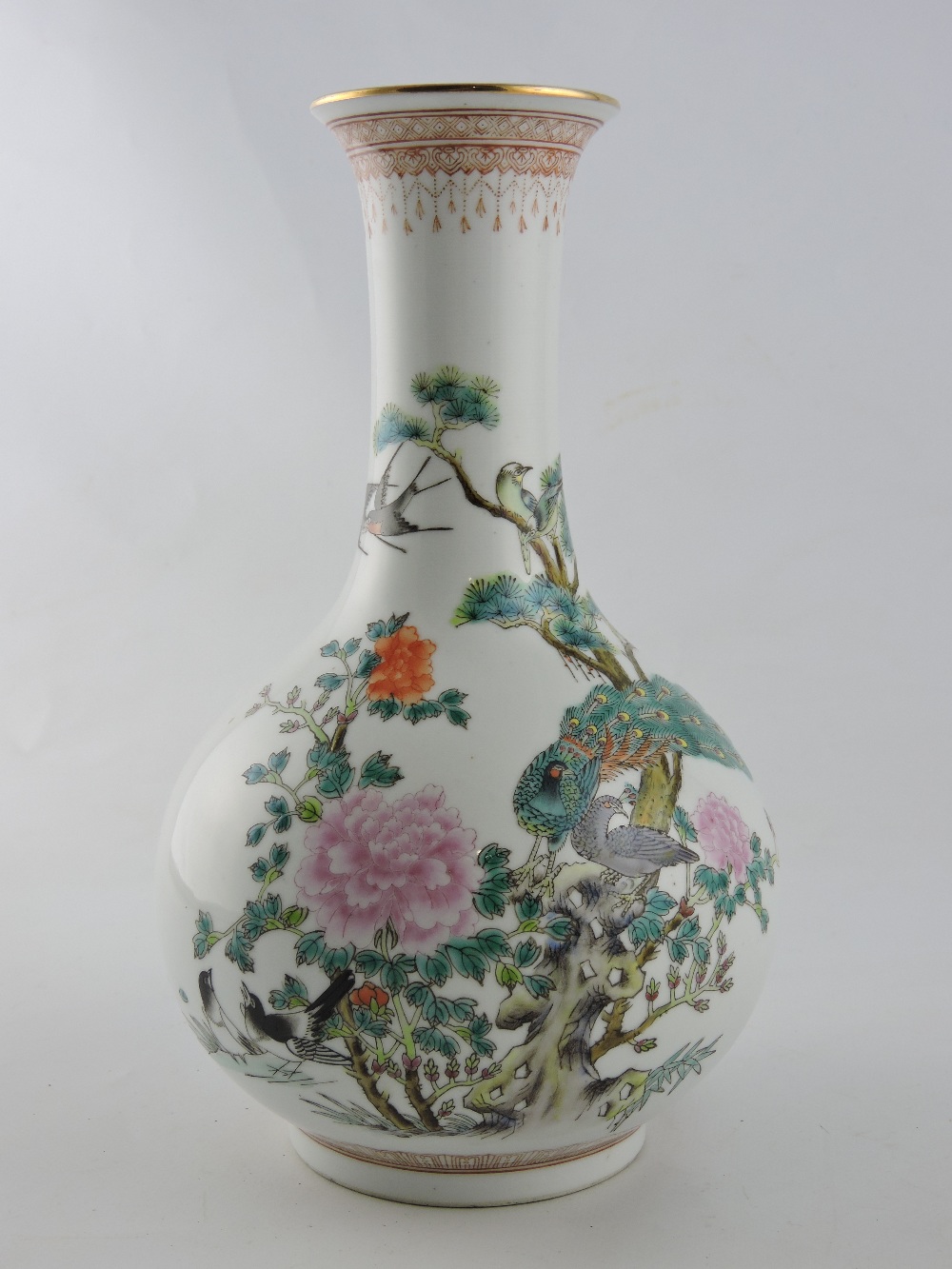 An early 20th century Chinese polychrome vase, decorated with birds and flowers, with six