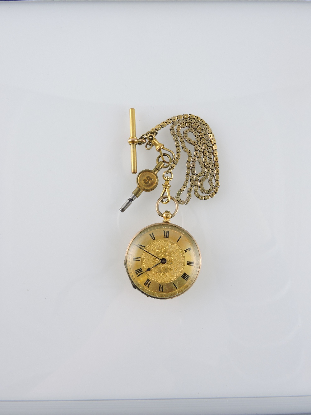 A pocket watch with case back marked 18k, gilt face, key wound, 35mm diameter, with chain marked