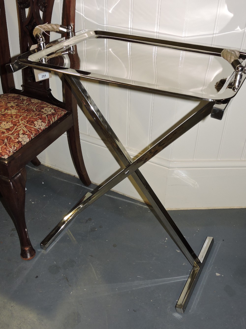 A chrome butler's tray, with ropetwist handles on folding X-frame, H. 75cm.