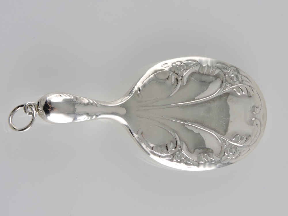 A miniature Art Nouveau style silver hand mirror.