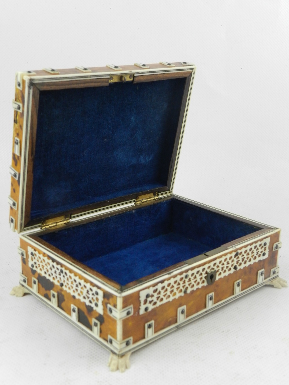 An Indian bone mounted tortoise shell inlaid trinket box, raised on four paw feet, together with a - Image 4 of 4