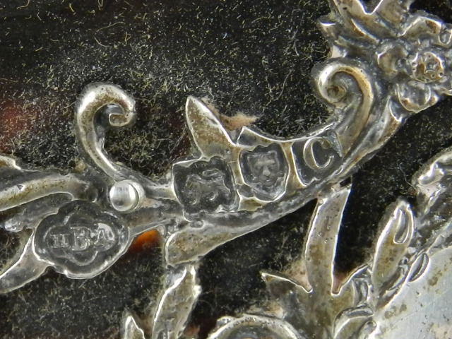 A late Victorian silver mounted tortoise shell blotter cover, centred with a monogrammed foliate - Image 2 of 2