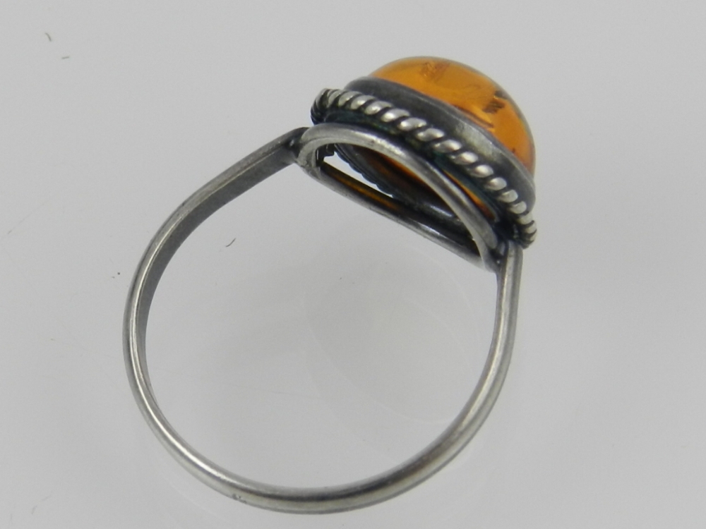 A silver cabouchon amber dress ring. - Image 2 of 2