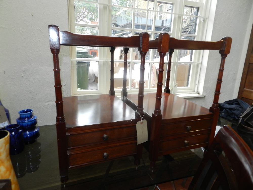 A pair of 19th century style mahogany night stands, having galleried top, raised on ring turned