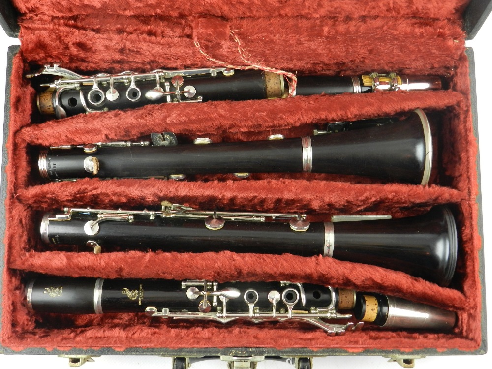 Boosey & Hawkes, London. A white metal mounted ebonised clarinet, together with one other, fitted - Image 2 of 3