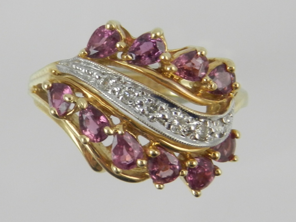 A 14ct yellow gold amethyst and diamond set dress ring.