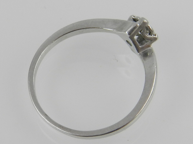 A 9ct white gold solitaire diamond cross over ring, centred with an illusion set brilliant cut - Image 2 of 2