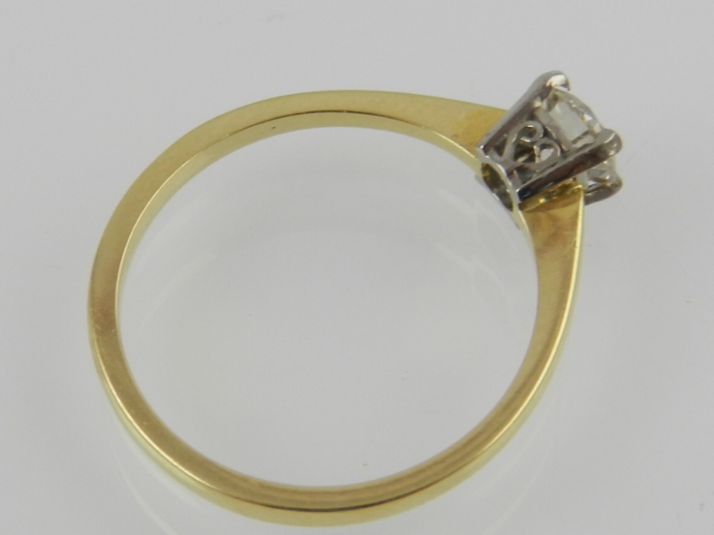 An 18ct yellow gold solitaire diamond ring, claw set with a round cut diamond. - Image 2 of 2