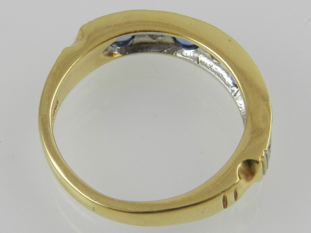 An 18ct yellow gold seven stone sapphire and diamond set dress ring. - Image 2 of 2