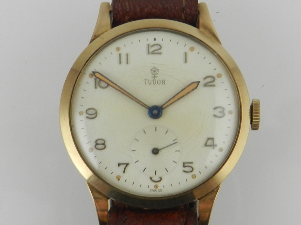 Tudor-Rolex, Geneva. A 1950's 9ct yellow gold gentleman's wristwatch, having a Rolex tonneou case,