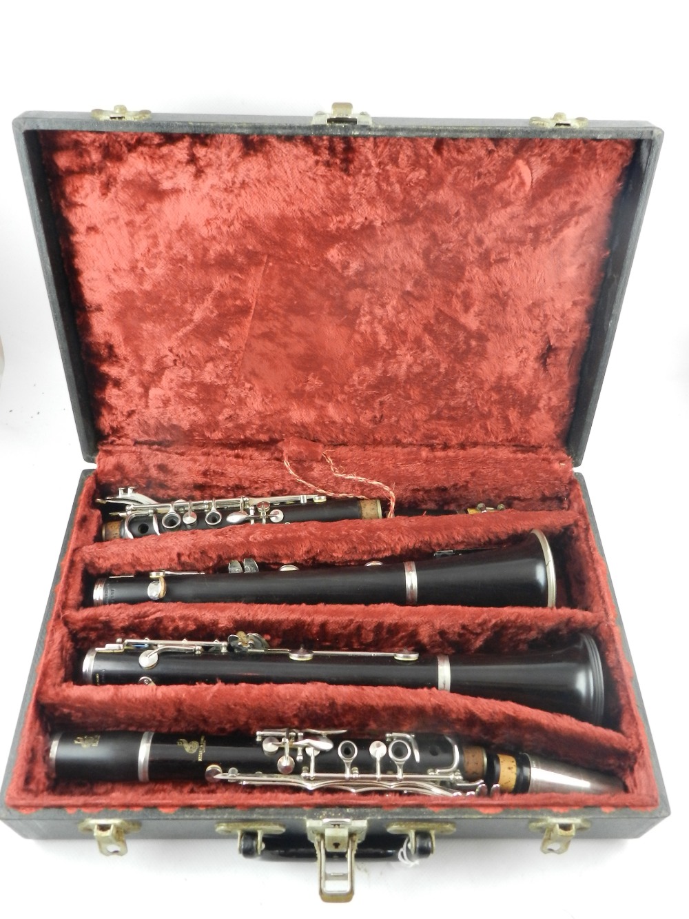 Boosey & Hawkes, London. A white metal mounted ebonised clarinet, together with one other, fitted