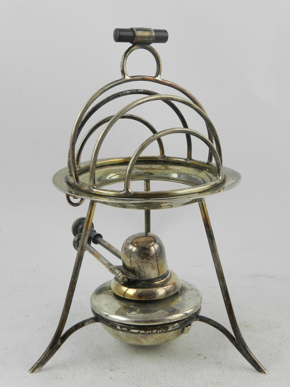 Asprey & Co. Ltd, London. A George V silver spirit fuelled toast warmer, having a four division