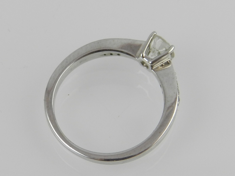 A 9ct white gold diamond dress ring, centred with brilliant cut stones of approximately .47cts, with - Image 2 of 2