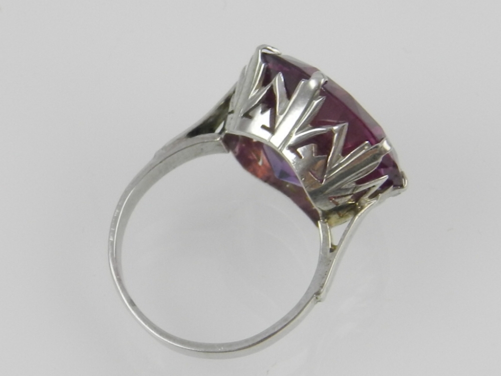 A white metal and synthetic purple stone dress ring. - Image 2 of 2