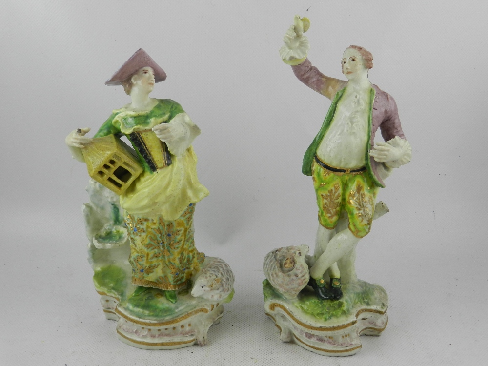 In the Derby taste. A pair of 18th / 19th century soft paste porcelain figures of a shepherd and