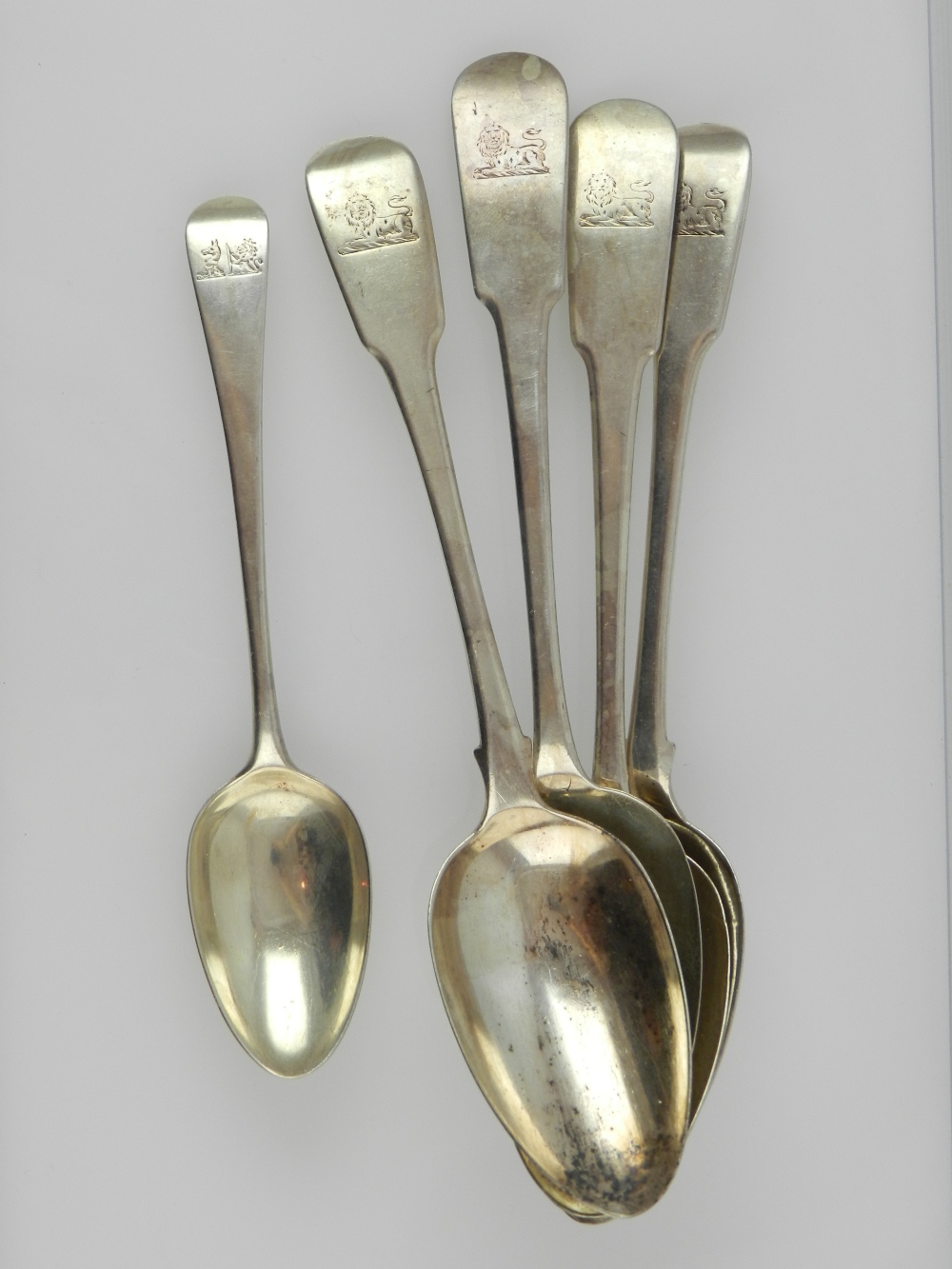 Two pairs of silver fiddle pattern serving spoons, hallmarked London 1934, the second pair