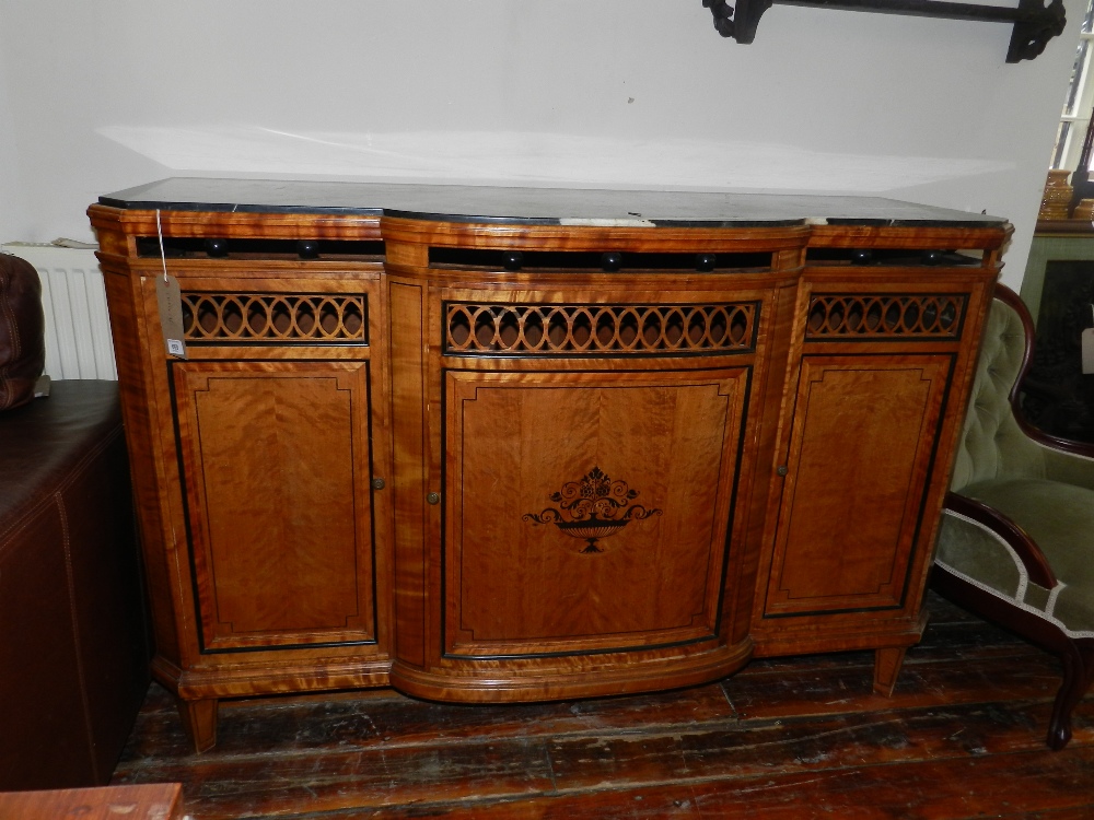 A Biedermeier style walnut break-front sideboard, having veined black marble top, above spindled