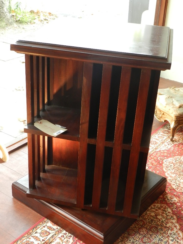 A mahogany revolving booktable, raised plinth base. H.73 cm W.50 cm D.49.5 cm