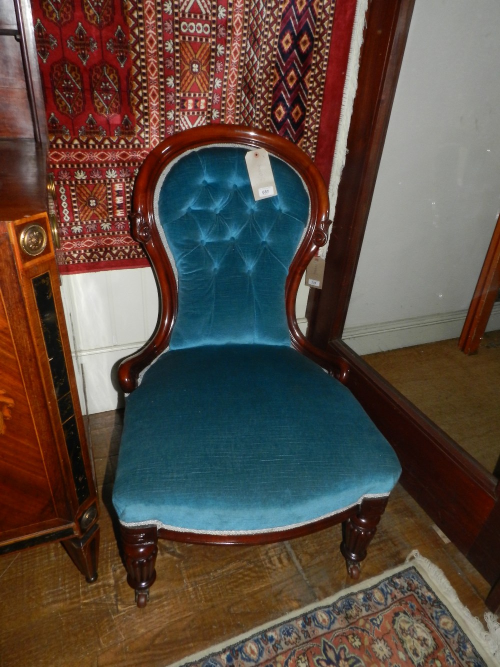 An early Victorian mahogany framed ladies library chair, button back upholstered with turquoise