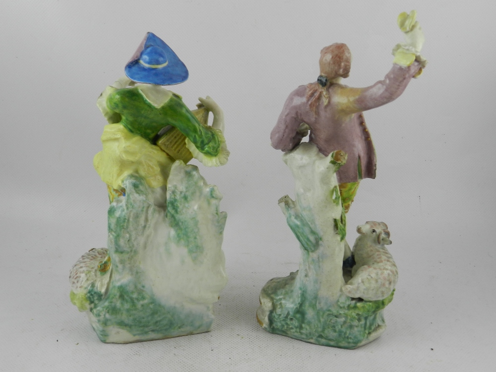 In the Derby taste. A pair of 18th / 19th century soft paste porcelain figures of a shepherd and - Image 2 of 3