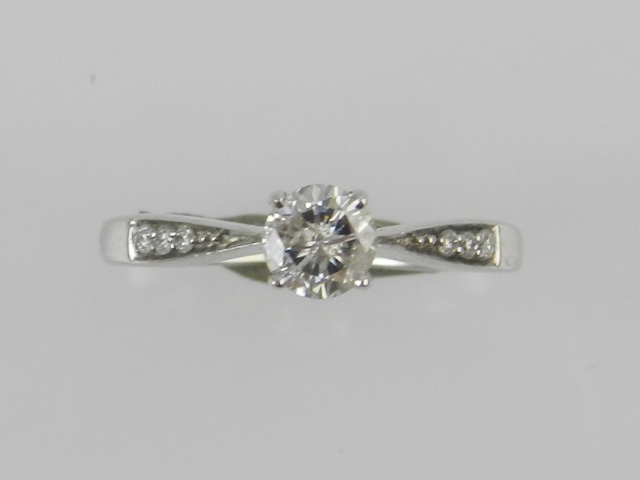 A 9ct white gold diamond dress ring, centred with brilliant cut stones of approximately .47cts, with