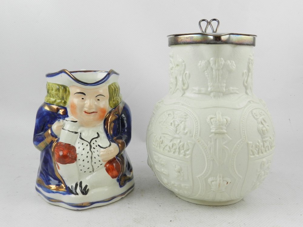 A Staffordshire pottery Toby jug, H: 13cm together with a W. B. Cobridge Albion Parian jug with