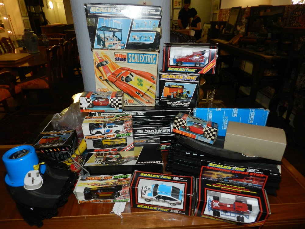 A large collection of 1970's/80's Scalextrics cars, tracks and associated item.