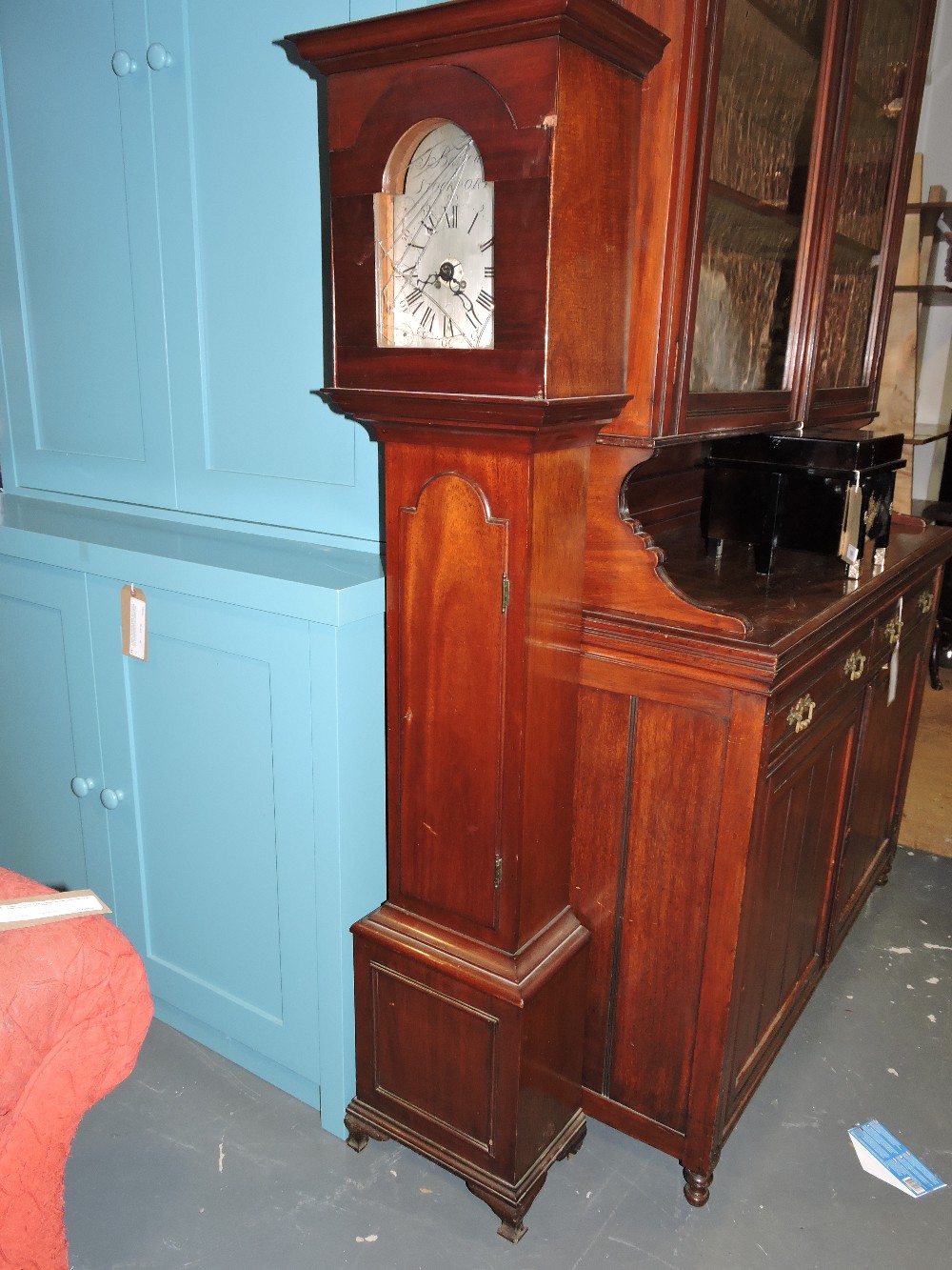 An early 20th century mahogany cased grandmother clock, the eight-day movement with arched