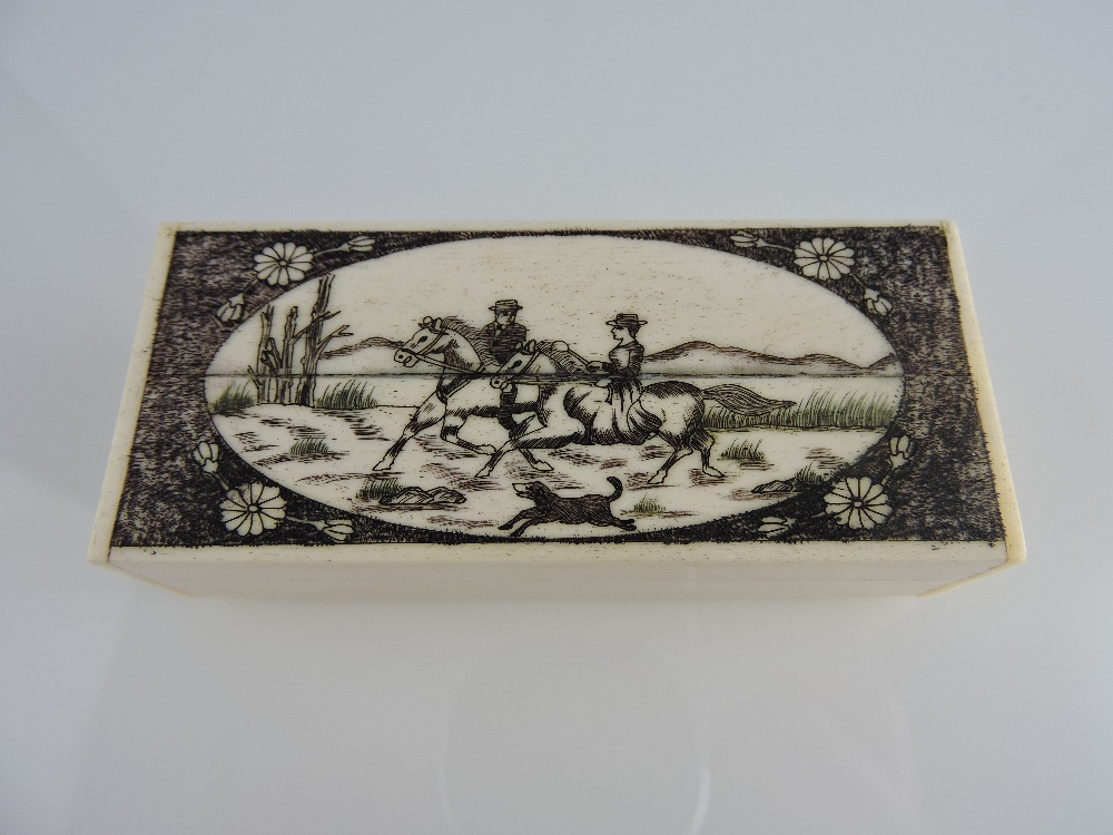 A scrimshaw-style rectangular bone box, the lid engraved with horses and riders, W. 9.5cm.