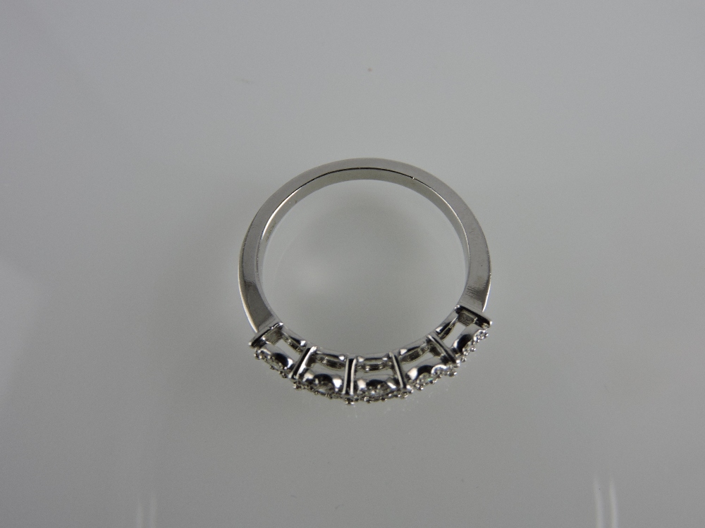 An 18ct white gold diamond cluster half-eternity ring, total weight 0.38ct. - Image 2 of 2