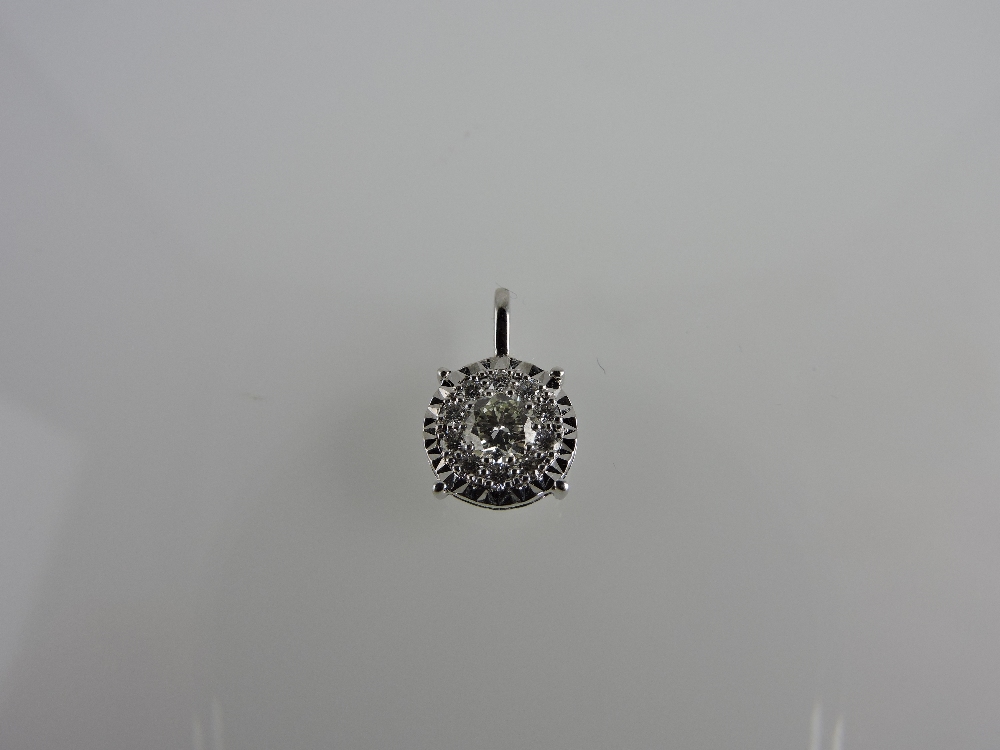 An 18ct white gold diamond cluster pendant, 0.51ct.