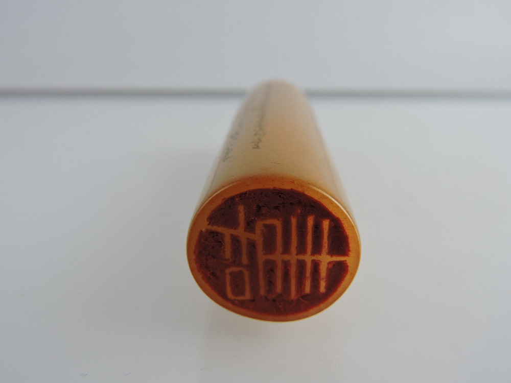 A Chinese yellow soap stone cylinder seal, finely carved with characters, L 8cm. - Image 2 of 2