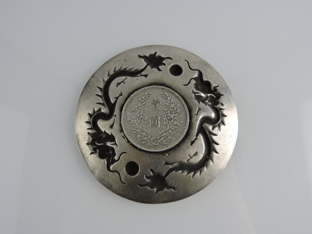 A Chinese Republic coin, mounted in a white metal dish modelled with dragons chains a flaming pearl, - Image 2 of 2