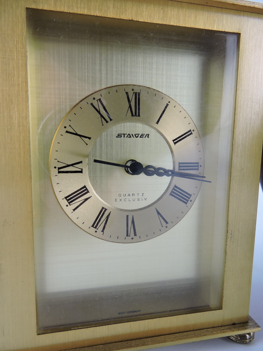 A late 20th century aneroid barometer, with a cream dial, brass case and mounted on a circular - Image 2 of 2