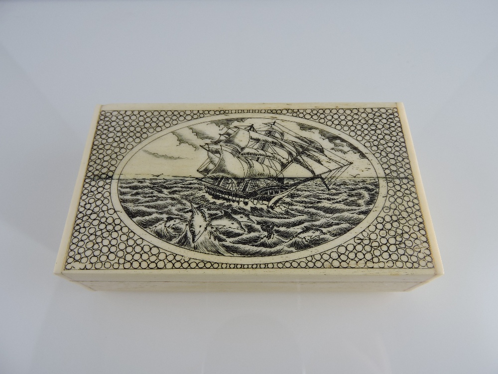 A large scrimshaw-style rectangular bone box, the lid engraved with a frigate at sea, W. 10.5cm.