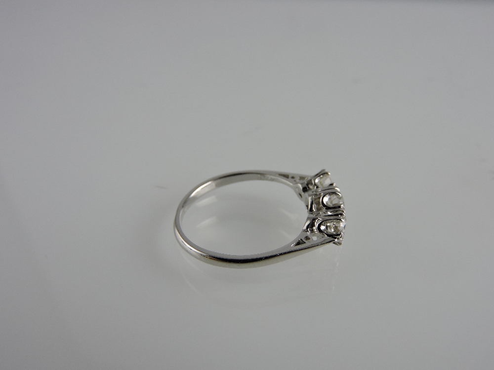 An 18ct white gold three-stone diamond ring, claw set, total weight 0.73ct. - Image 2 of 2