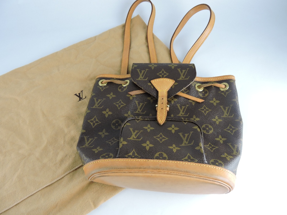 A Louis Vuitton ladies mini montsouris hand bag, in monogrammed brown cloth with tan leather base