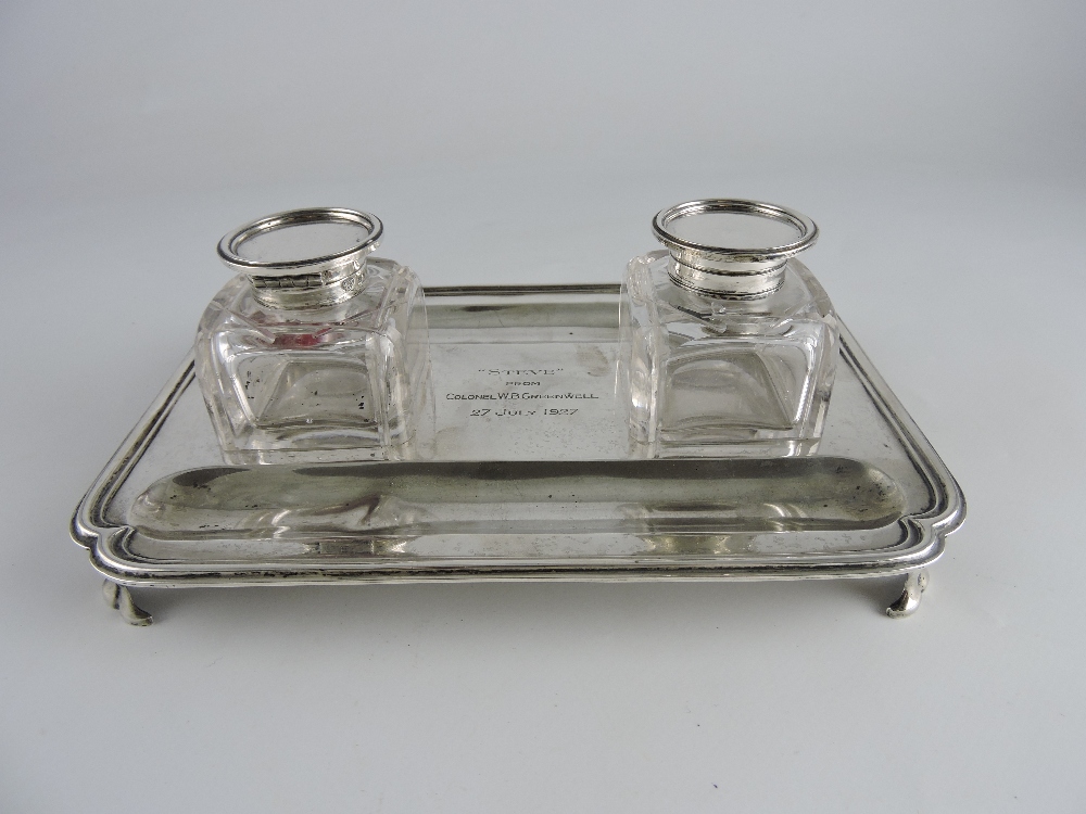 A rectangular silver standish, London 1919, with two square cut glass silver topped ink wells, of